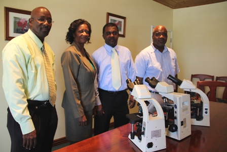 (L-R) Pastor of the Charlestown Seven Day Adventist Church Jerry Languedoc, Permanent Secretary in the Ministry of Health Ms. Angelica Elliott, Acting Hospital Administrator Mr. Johnson Morton and Medical Lab Supervisor Mr. Clester Roberts